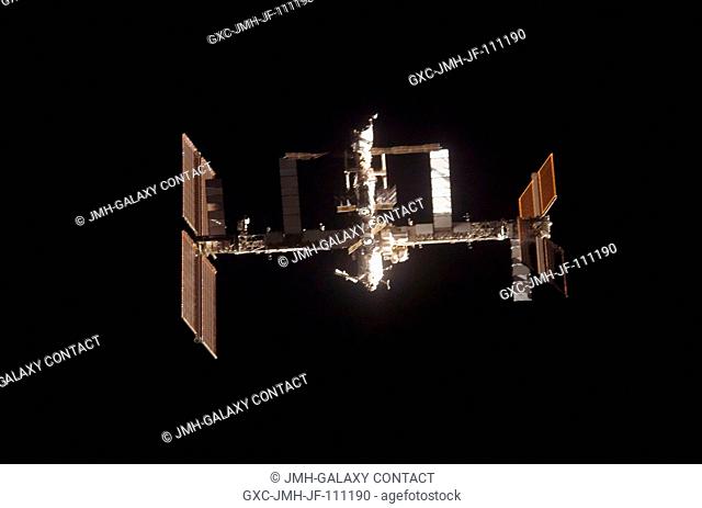 The International Space Station is featured in this image photographed by a STS-120 crewmember as Space Shuttle Discovery approaches the station during...