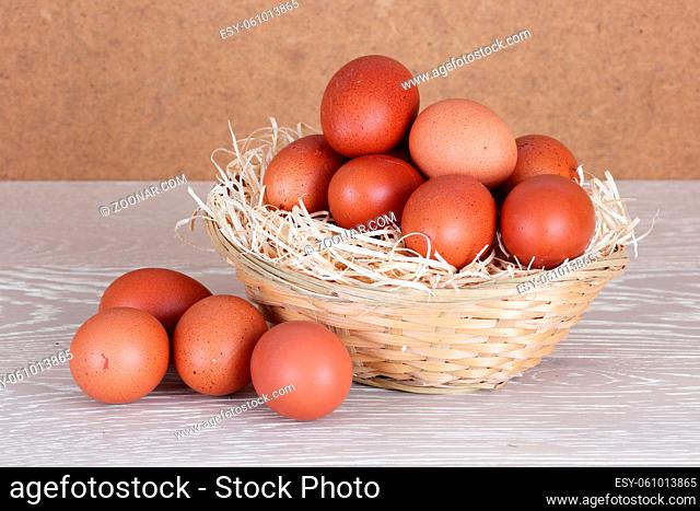 Farm fresh organic eggs on wood surface
