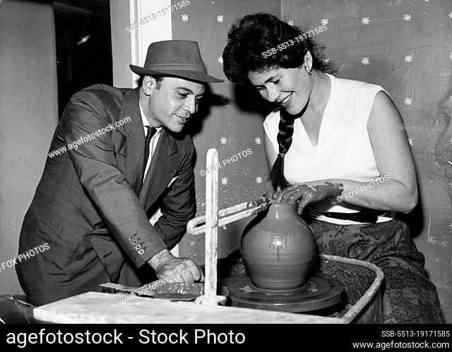 The Actor And The Pottery's Wheel - Actor and pottery expert Herbert Lom watches as an ornament gradually takes shape in the sensitive hands of Mrs