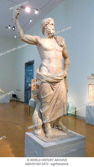 Statue of Poseidon made of Parian marble found on Milos along with the statue of Amphitrite. In his raised right hand he will have held the trident and next to...