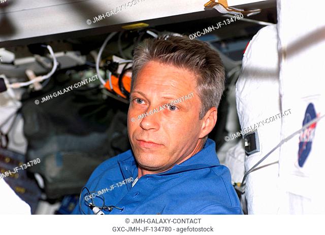 Astronaut Thomas Reiter, who represents the European Space Agency, is shown on the middeck of the Space Shuttle Discovery but will soon be moving into his new...