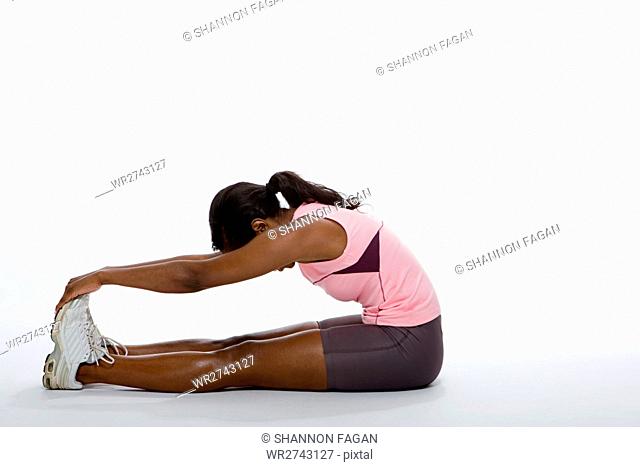 one woman stretching