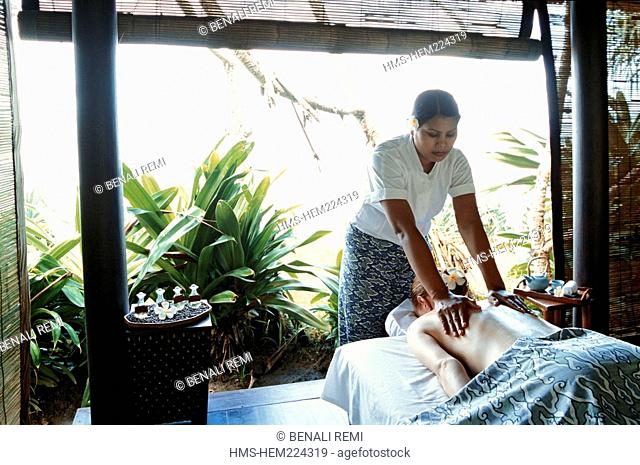 Indonesia, Bali, Alila Manggis Resort, guest receiving a massage in the outdoor spa bale at Spa Alila