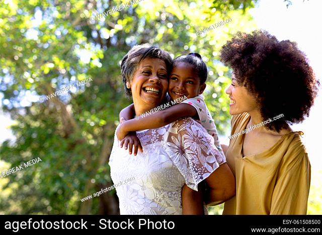 Multi-generation mixed race family enjoying their time at a garden