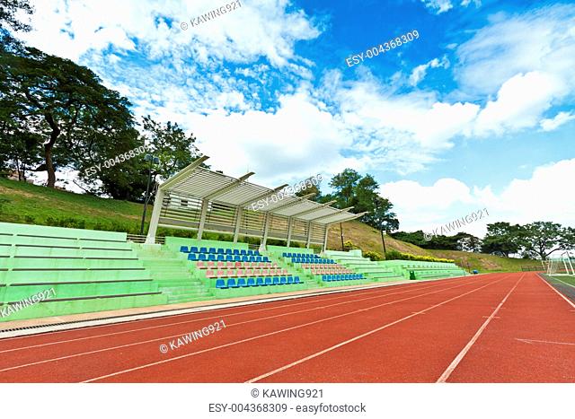 Stadium chairs and running track in a sports ground