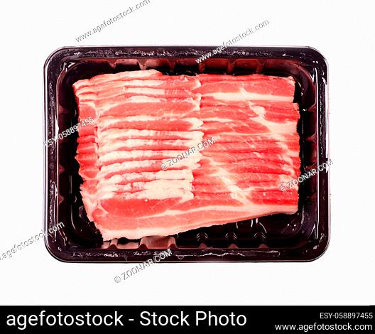 Raw stripes of raw bacon in package isolated on a white background