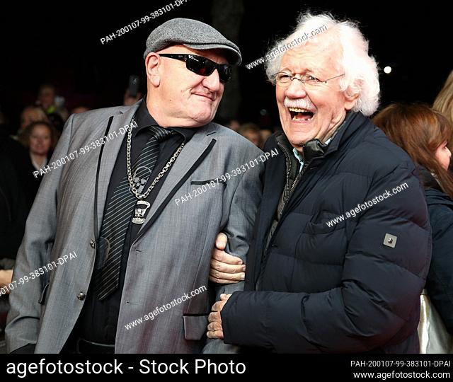 07 January 2020, Hamburg: Eddy Kante (l), bodyguard and actor, and Carlo von Tiedemann, presenter, come to the premiere of the film ""Lindenberg! Do your thing