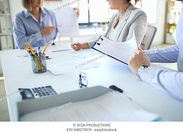 business team discussing report at office