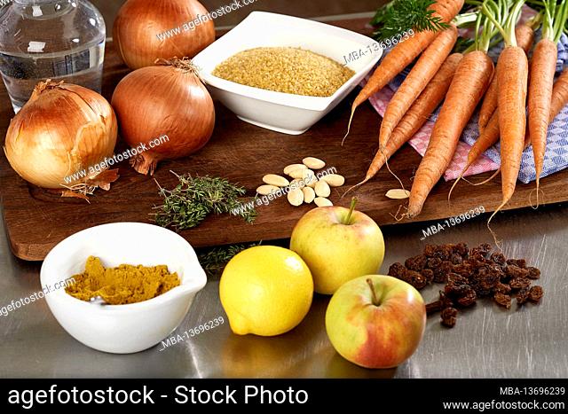 Ingredients for dish of couscous stuffed onion with apples, lemons, currants, thyme, almonds, carrots. Ras al Hanout