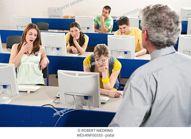 Germany, Emmering, Students getting bored in computer lab