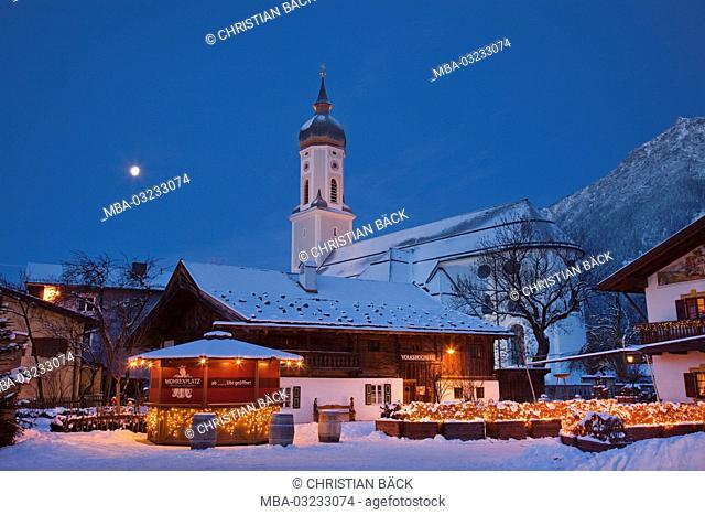 Church and old farmhouse on the square 'Mohrenplatz', Garmisch-Partenkirchen, Bavaria, Germany