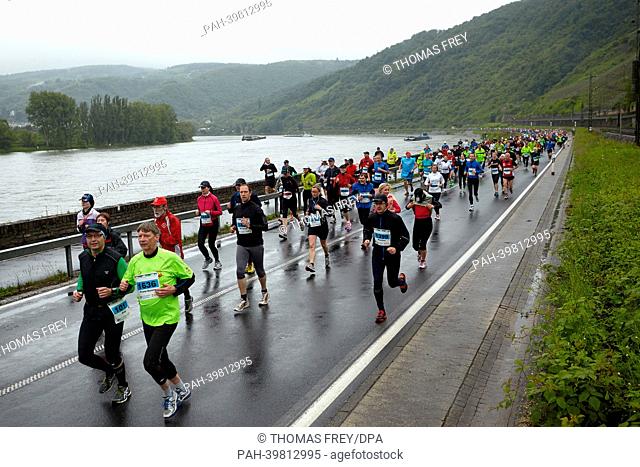 People run the half-marathon route along the Rhine Valley during the Middle Rhine Marathon near Boppard,  Germany, 26 May 2013