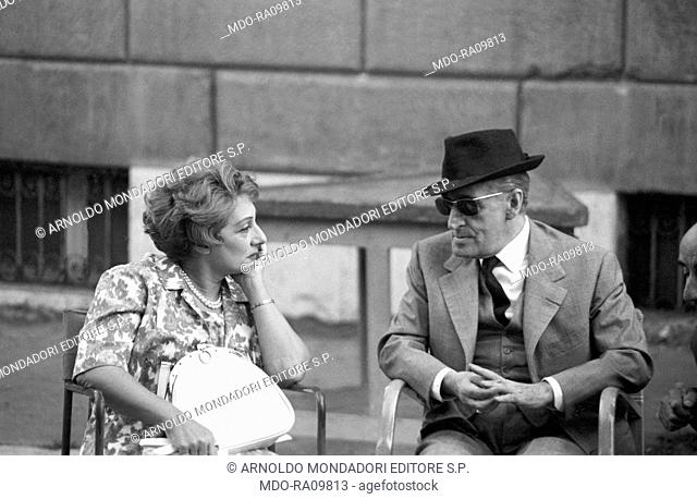 Italian actor Totò (Antonio De Curtis) talking to Italian actress Andreina Pagnani (Andreina Gentili) during a break on the set of Il comandante