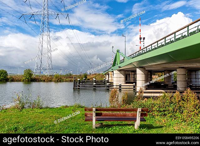 Dutch summer landscape with steel bridge over river Vecht near Amsterdam