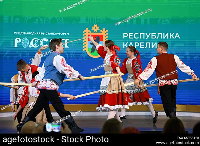 RUSSIA, MOSCOW - DECEMBER 21, 2023: Members of a dance ensemble perform at the opening of Karelia Republic Day at the Russia Expo international exhibition and...
