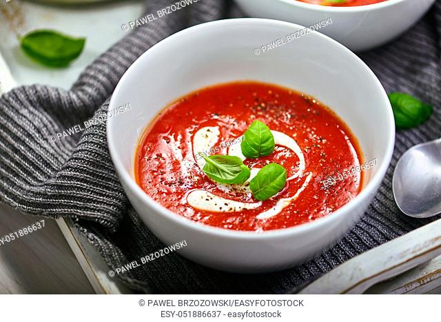 Tomato cream soup with sour cream and basil