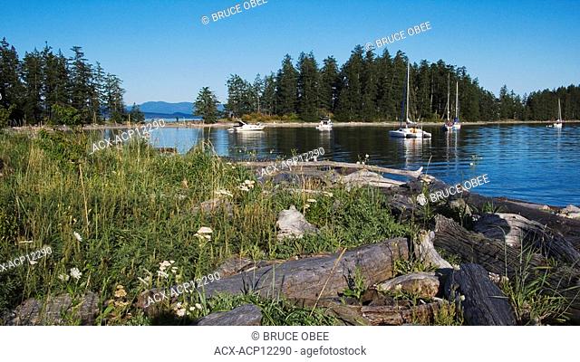 Boats anchor in Rebecca Spit Marine Provincial Park on Quadra Island, off the east coast of Vancouver Island, British Columbia, Canada