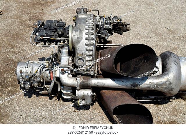 The helicopter engine which is pulled out outside. Spare parts and details of a design of helicopters