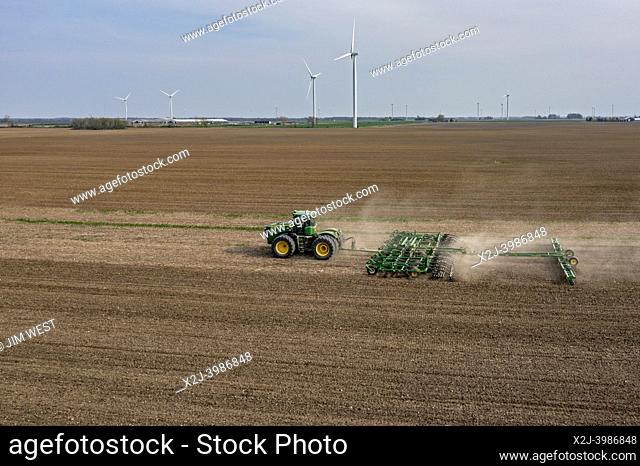 Pinnebog, Michigan - A tractor plows a farm field in Michgan's thumb