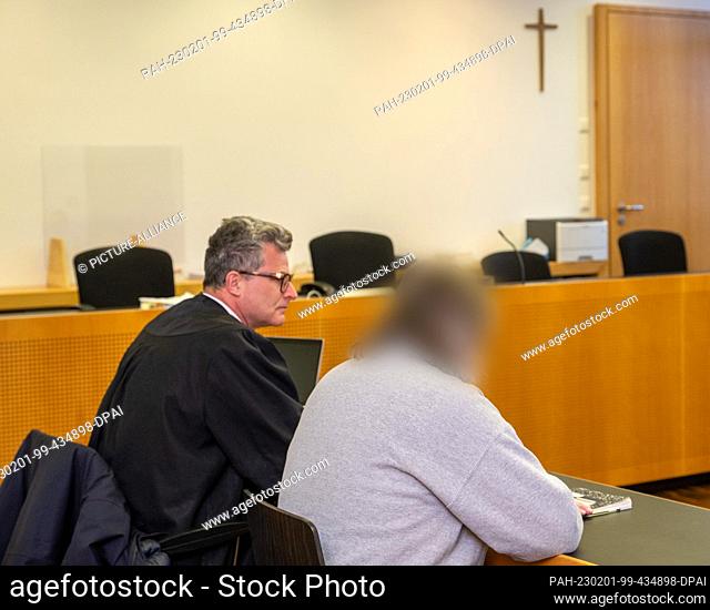 01 February 2023, Bavaria, Augsburg: The defendant (r) sits in the dock at the Criminal Justice Center with his lawyer Detlev Binder (l)