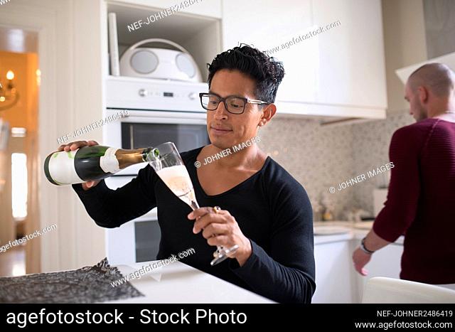 Man pouring champagne