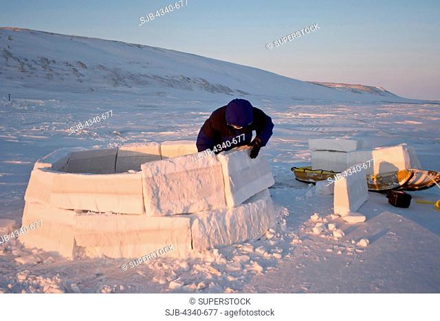 Inupiaq Man Builds an Igloo Snow Blind