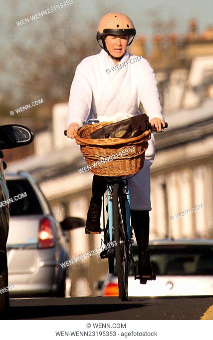 Renee Zellweger causes traffic chaos by riding into oncoming traffic on a bike in her dressing gown on Albert Bridge! Featuring: renee zellweger Where: London