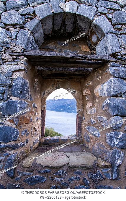 A window in the wall of Sotiros Monastery looking to Laconian Bay