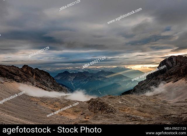 Fog and cloudy sky with sunbeams in the background, in the Hinterkar vom Karwendel