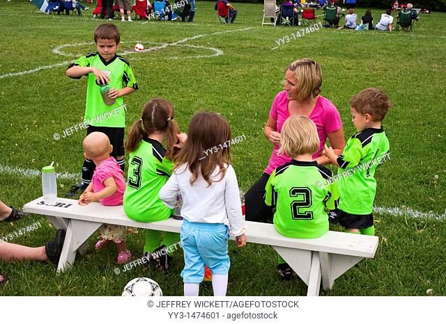 Soccer mom coaching kids league in Sheridan, Indiana, USA
