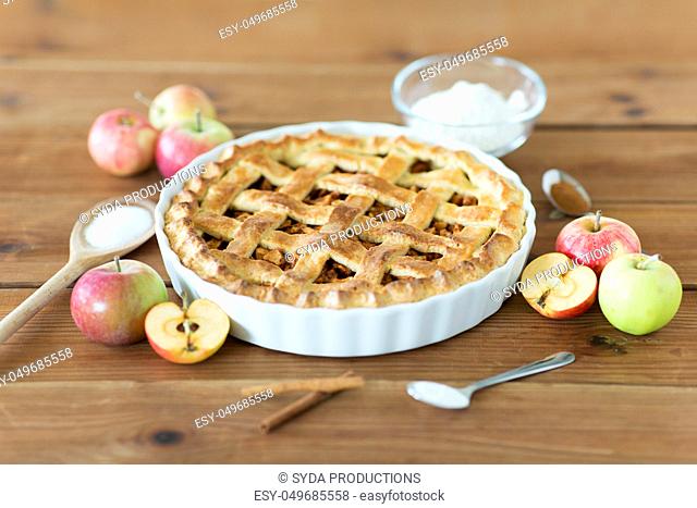 close up of apple pie on wooden table