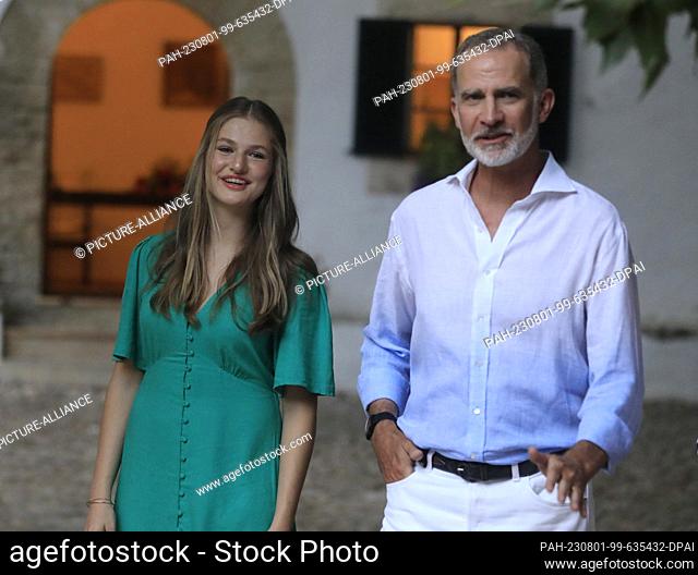 31 July 2023, Spain, Bunyola: Felipe VI, King of Spain, and his daughter Leonor, Princess of Spain, visit the village of Bunyola during their summer vacation