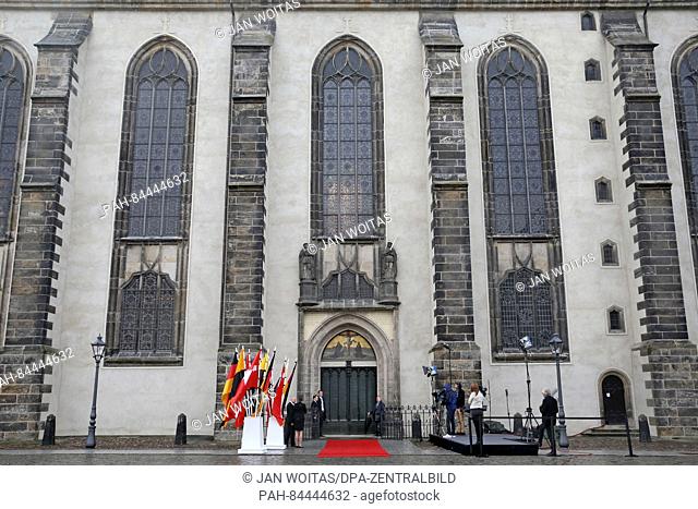 A red carpet lies in front of the Theses' Door of the All Saints' Church ahead of the service for its re-opening in Wittenberg, Germany, 02 October 2016