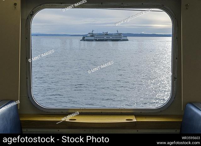 View across water from a ferry boat window, a ferry in Puget Sound