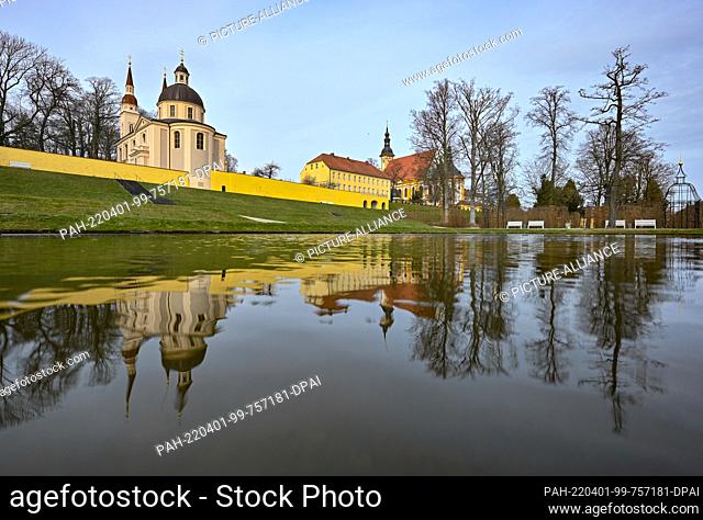 01 April 2022, Brandenburg, Neuzelle: View from the monastery garden of the Protestant (l) and Catholic (r) churches of Neuzelle Monastery