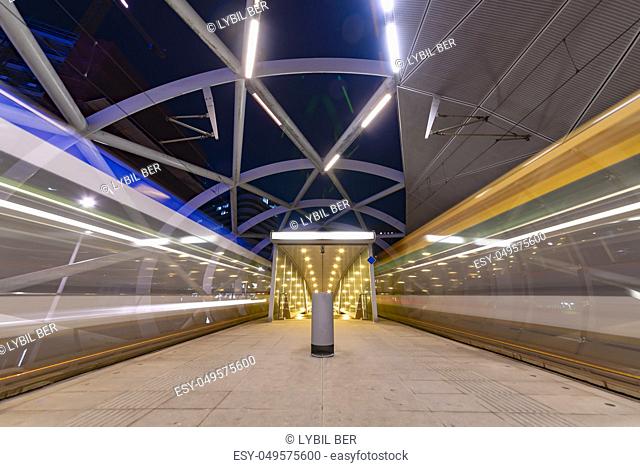 The Hague Beatrixkwartier tram station platform illumated at night waiting for passengers during the blue hour, The Hague, Netherlands