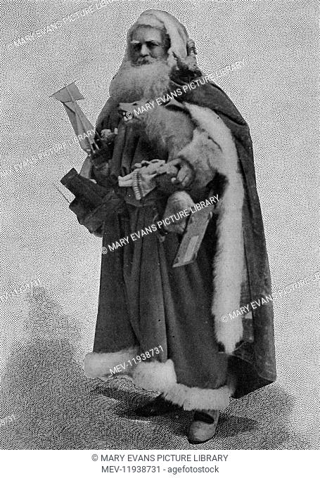 Father Christmas, or, according to the picture caption, Jack Frost, dressed in full red cloak and fur and with an armful of toys