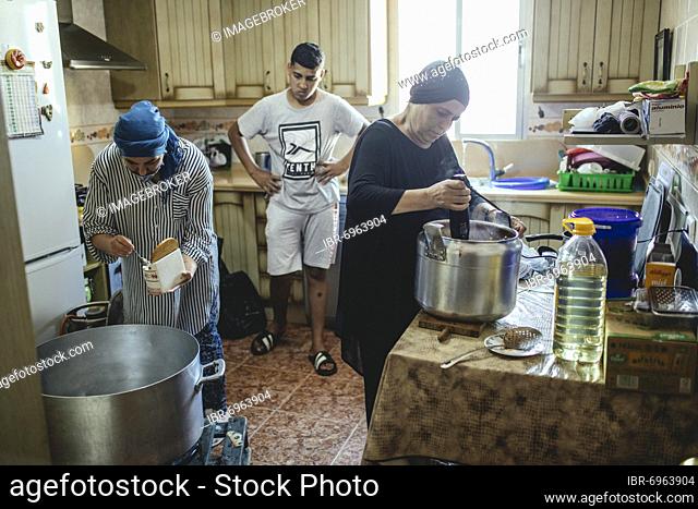 Preparing meals for more than 200 migrants in the house of Sabah Mohamed, Ceuta, Spain, Europe