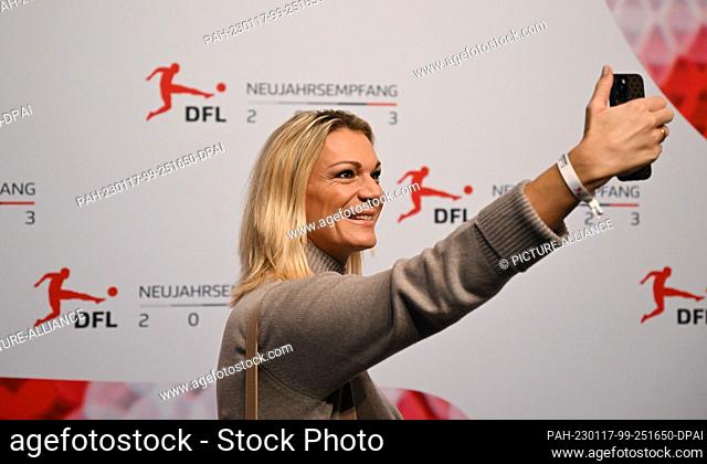 17 January 2023, Hessen, Offenbach/Main: Maria Höfl-Riesch, double Olympic champion and former ski racer, takes a selfie upon her arrival at the DFL New Year's...