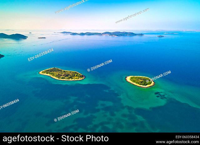 Two lonely stone islands in Zadar archipelago aerial view, Dalmatia region of Croatia