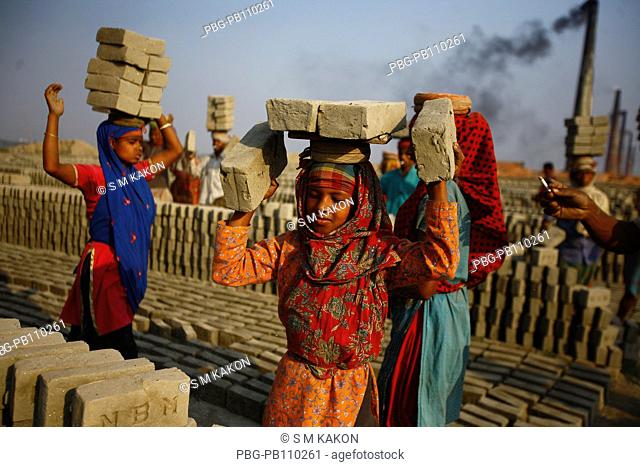 Child workers carrying bricks on his head at Fatullah Narayanganj, Bangladesh February 2011