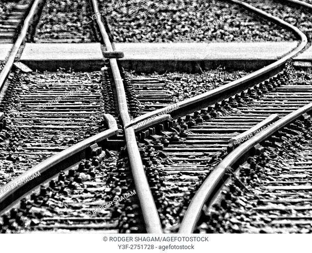 Black and white image of a railroad intersection. The line point changes the direction of the train to branch off somewhere else