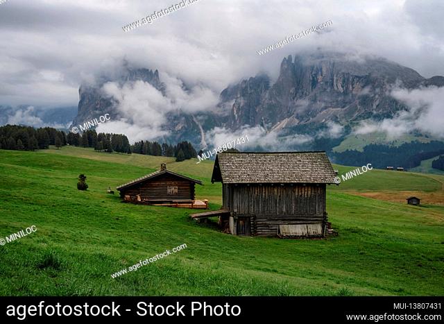 Wooden shelter huts in Alpe Di Siusi, Dolomites, Italian Alps. Europe