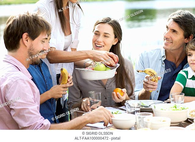 Family enjoying healthy picnic