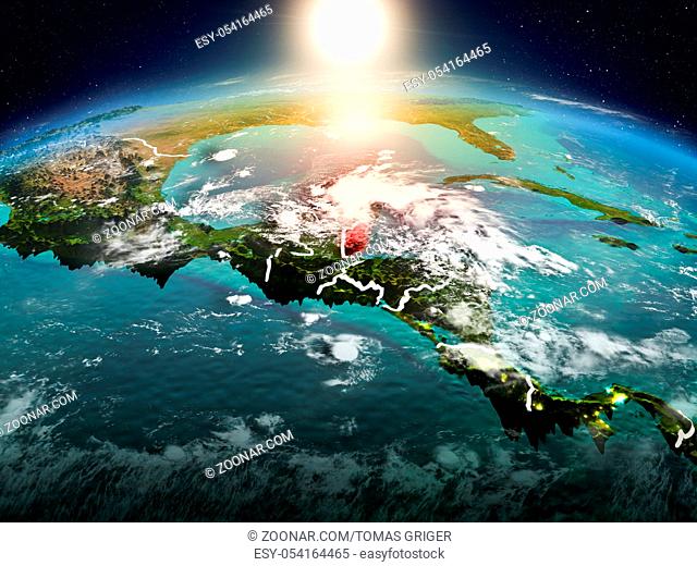 Sunrise above Belize highlighted in red on model of planet Earth in space with visible country borders. 3D illustration. Elements of this image furnished by...