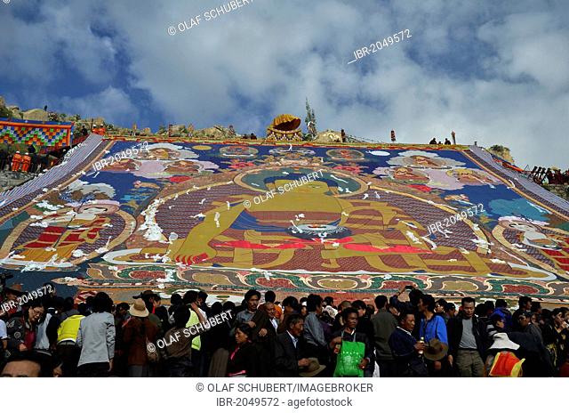 Tibetan Buddhism, visitors of the Thangka, a giant Buddha image is unfurled during the Shoton, Sho Dun or Yoghurt Festival, Drepung Monastery, Lhasa, Tibet