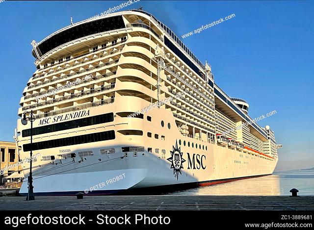 Cruise ship docks in the port of Trieste after sunrise - Italy