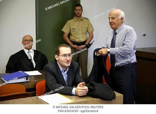 Defendant Markus R, a former employee of Germany's foreign intelligence agency (BND) and his lawyers Klaus Schroth (L) and Wolfgang Lechner (R) arrive for the...