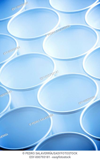 large group of white disposable plastic cups