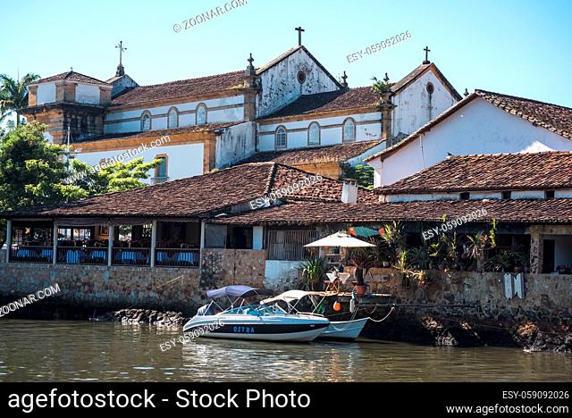 Paraty, Brazil - February 28, 2017: An iconic view of the canal and the colonial houses of the historic town Paraty, Rio de Janeiro state, Brazil